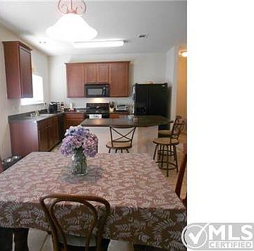 Eat-in kitchen with recessed lighting, and decorative lighting i