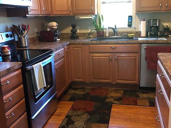 Kitchen with wood floors.