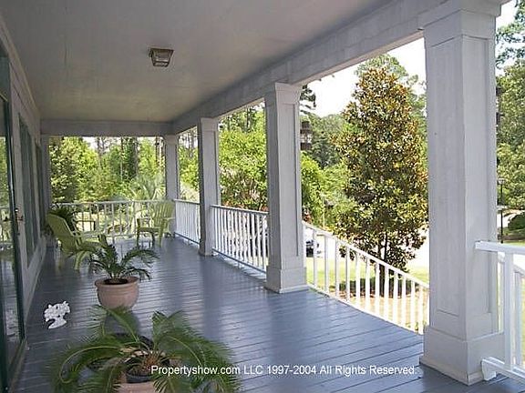 Covered Porch Overlooks Front Yard