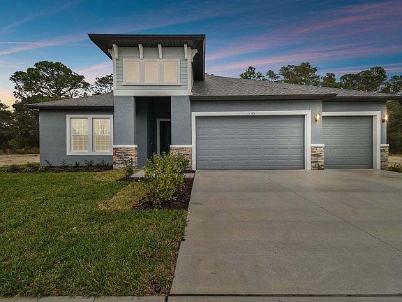 Sapphire new construction quick move-in home 1285 Kelsa Anne Dr. front elevation at dusk at Whiting