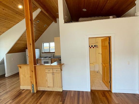 Living room to left, kitchen to front, bathroom through door, 2 bedrooms to right