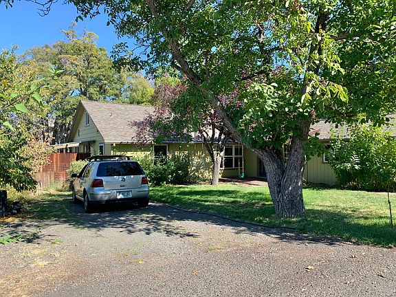 Parking on either side of the house with room for up to 4 cars