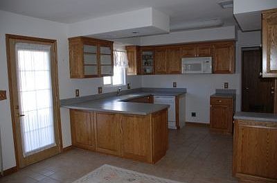 Upgraded kitchen with tiled floors.
