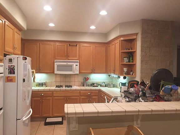 Kitchen with double door refrigerator, gas stove, double oven