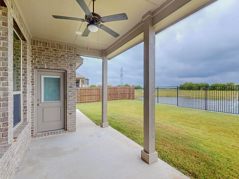 Step out onto this covered and cooled patio