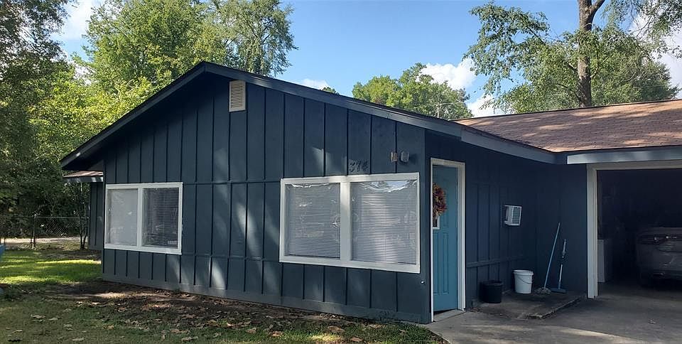 Exterior includes single car garage.