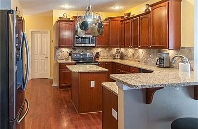 The living room off of entry is a cozy and well lit.