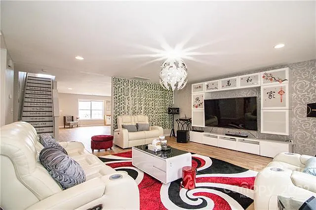 Open concept family room has south facing windows with lots of sunlight