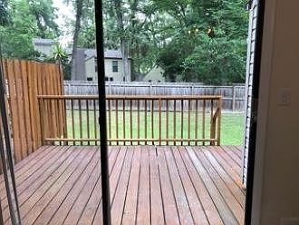 Private deck with shared back yard