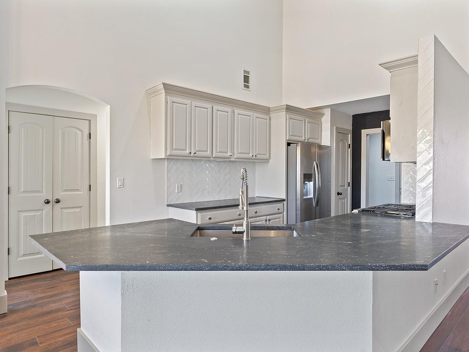 Kitchen View with Bar Area and Sink