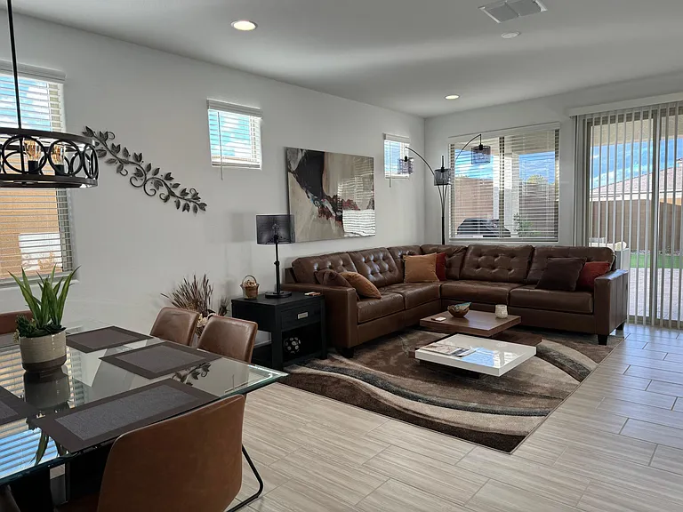 Living Room area looking to back yard with dining area in foreground