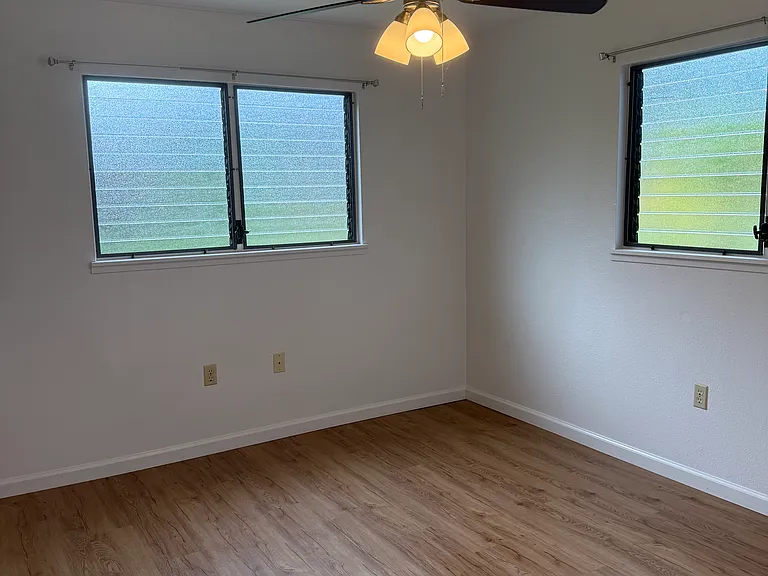 Bedroom with new fan, updated flooring throughout