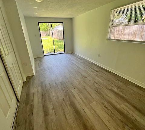 Bedroom 1 - Large master bedroom with sliding door to backyard.