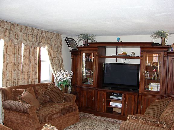Living Room Features HRWD Floors and Bay Window!