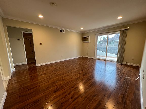 Spacious living room with wood flooring