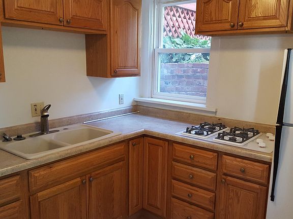 Kitchen w new cabinets and gas cook top range, Deep bowl sink. Moen faucett.