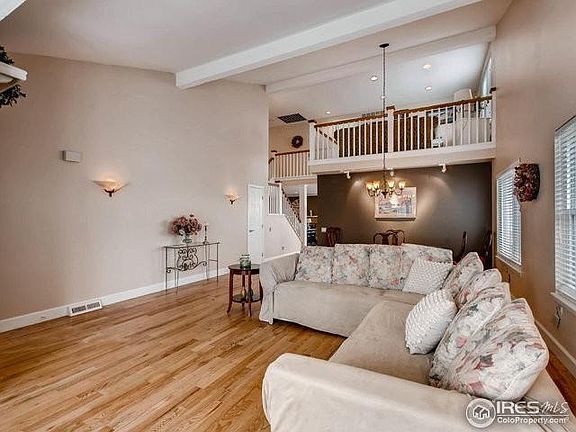 Formal Living Room with View to Upstairs Balcony