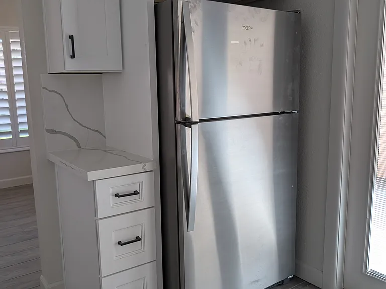 New kitchen cabinets, countertops, sink, faucette, and appliances.