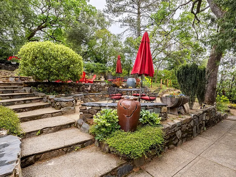 Terraced back yard with many places to relax.