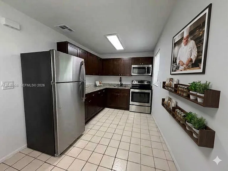 7720 Raleigh St — Photo 7