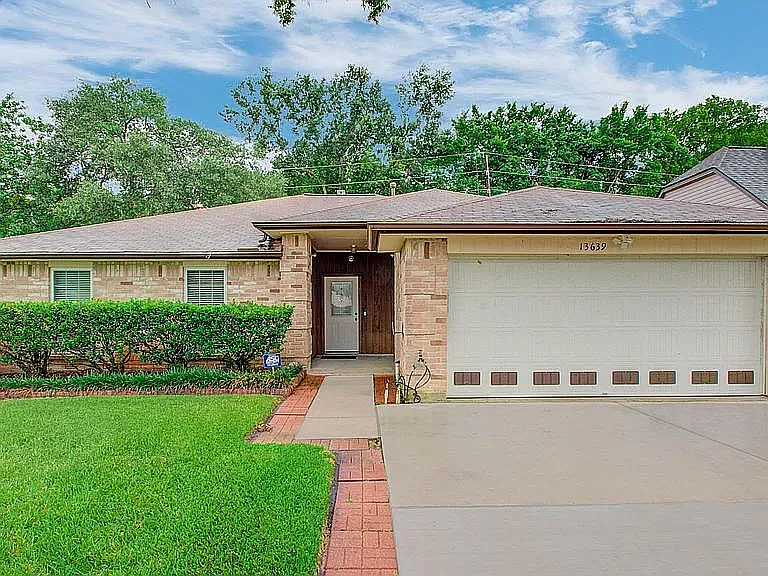 Beautiful curb appeal with a welcoming entrance and attached 2-car garage.