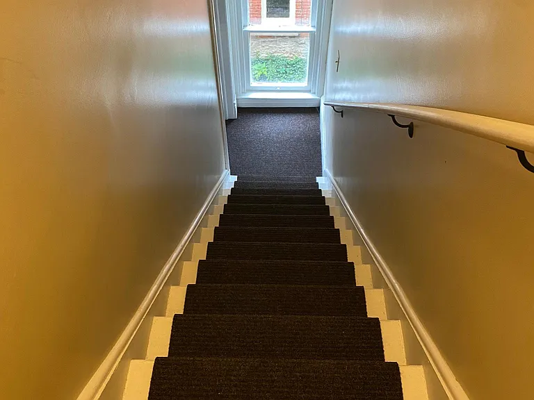Stairs up to reach the Loft 2 BR