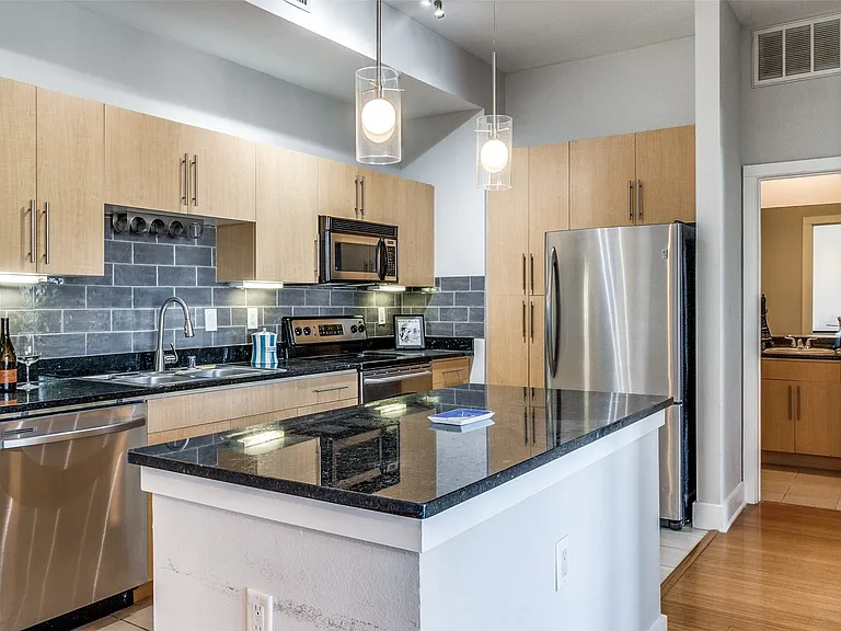 Open kitchen with island bar.