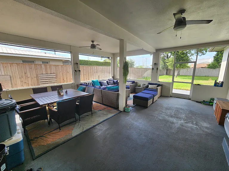 Screened in Florida room with all the amenities needed to host or just enjoy a night lounging in.