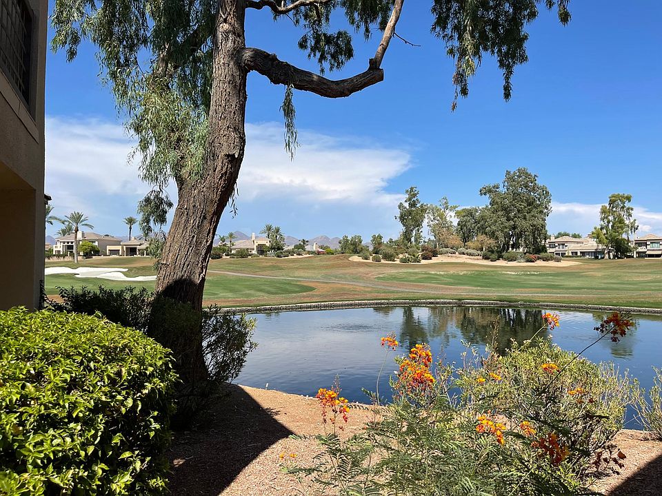 The view from the front walkway leading to the front door. Variations of this view- golf course, lake, and/or mountains can be see from throughout the home.