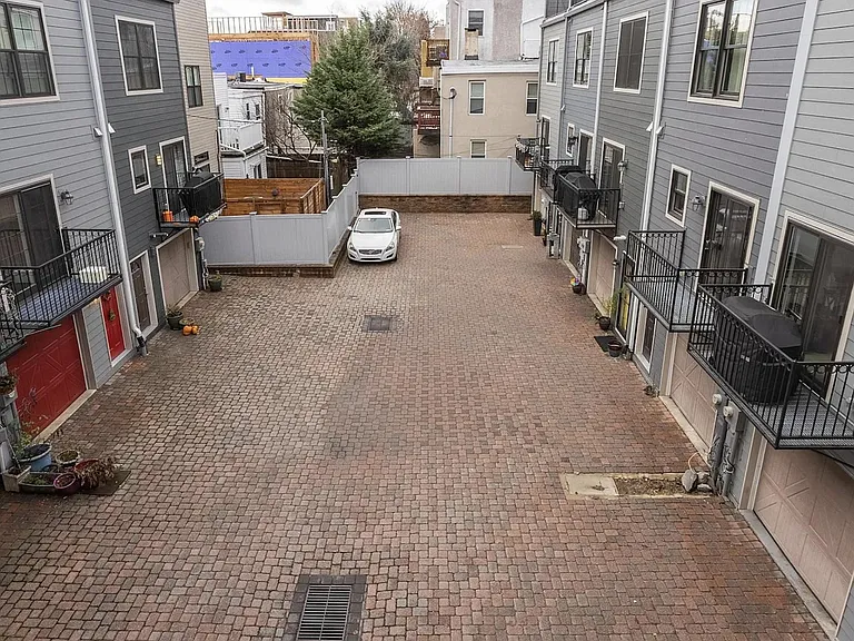 View of courtyard and dedicated parking spot.