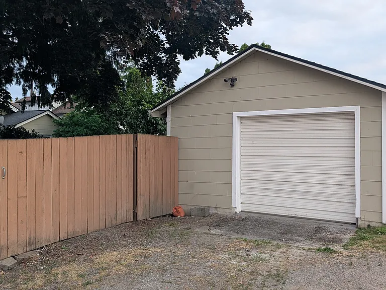 Detached 1-car garage with new deck leading from house to garage.