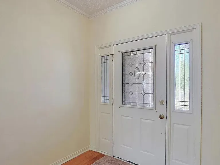 Inside, looking at front door (to exit into front yard)