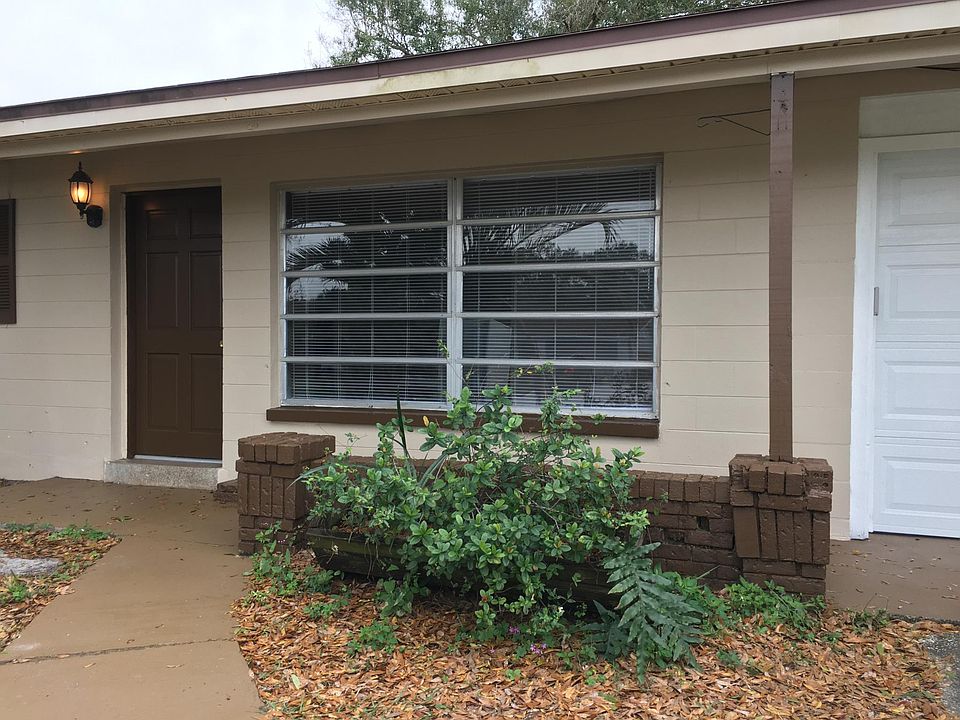 Sitting area on front porch. House sits on the hill, with territorial view, under shady oak tree.