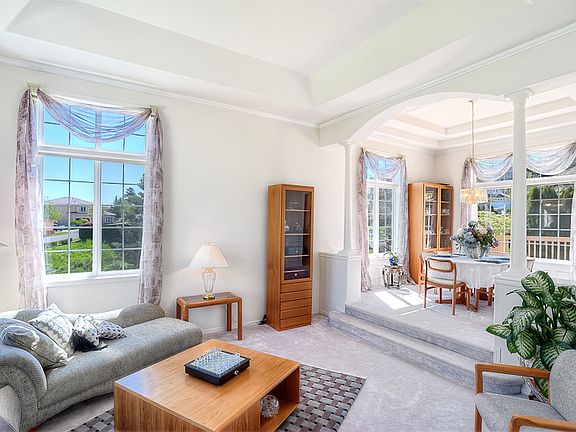 Enter to the soaring ceilings and wonderful open space in your formal living room.
