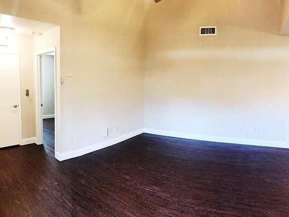 Note the high ceilings in the living room area. Make the place feel so much more open. My last few tenants decorated the living room with a comfortable L shaped couch and mounted the tv on the wall. All this on top of a beautiful rug. It was so cozy.
