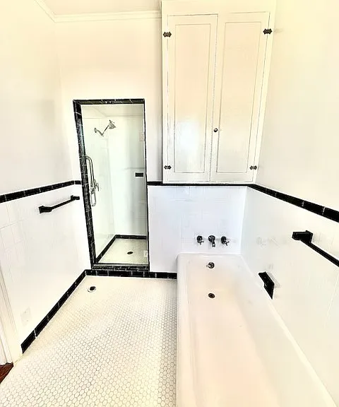 Unit #504 primary bathroom shower and bathtub!