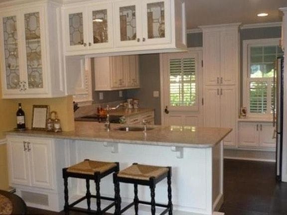Kitchen opens onto dining room