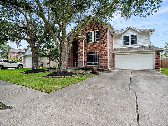 Another wonderful view of the home shows mature trees offering the perfect amount of shade w/out taking away from the home's curb appeal. That way we can see the outdoor updates which include a new roof in 2016, as well as new gutters & solar screens