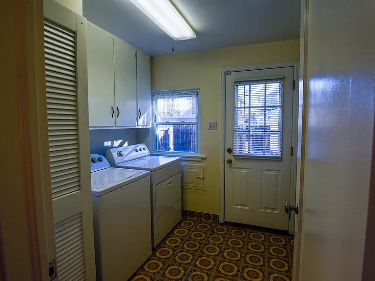 Laundry room. Washing and Dryer hookups. Washer and dryer not included but is available to purchase from previous tenant for $150.00. Water heater and additional pantry on right side of exterior door.