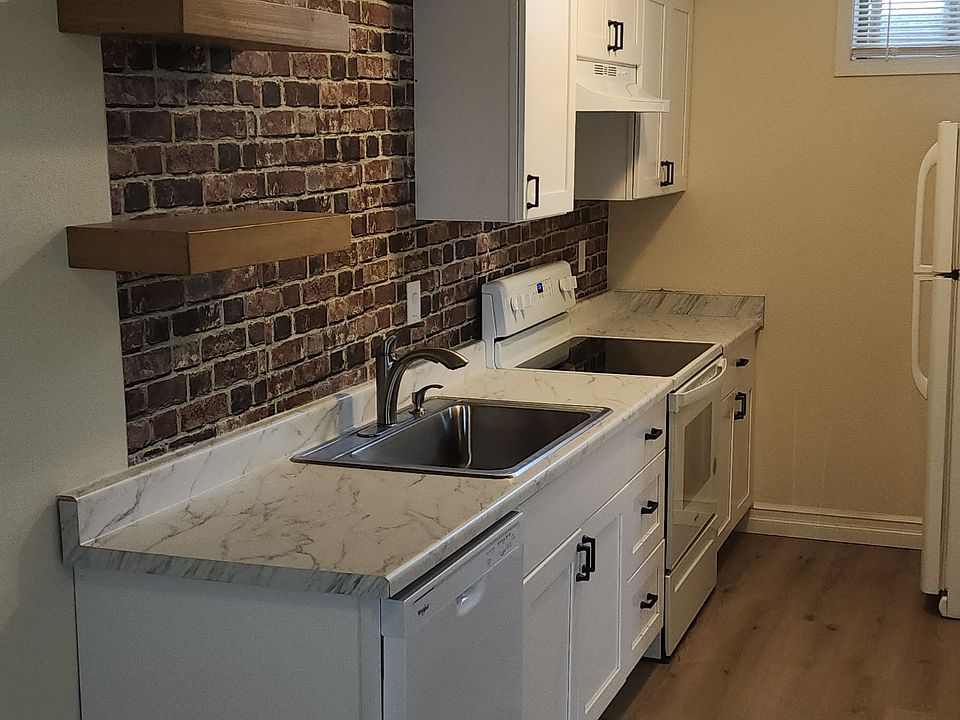 Kitchen with new dishwasher, stove and refrigerator