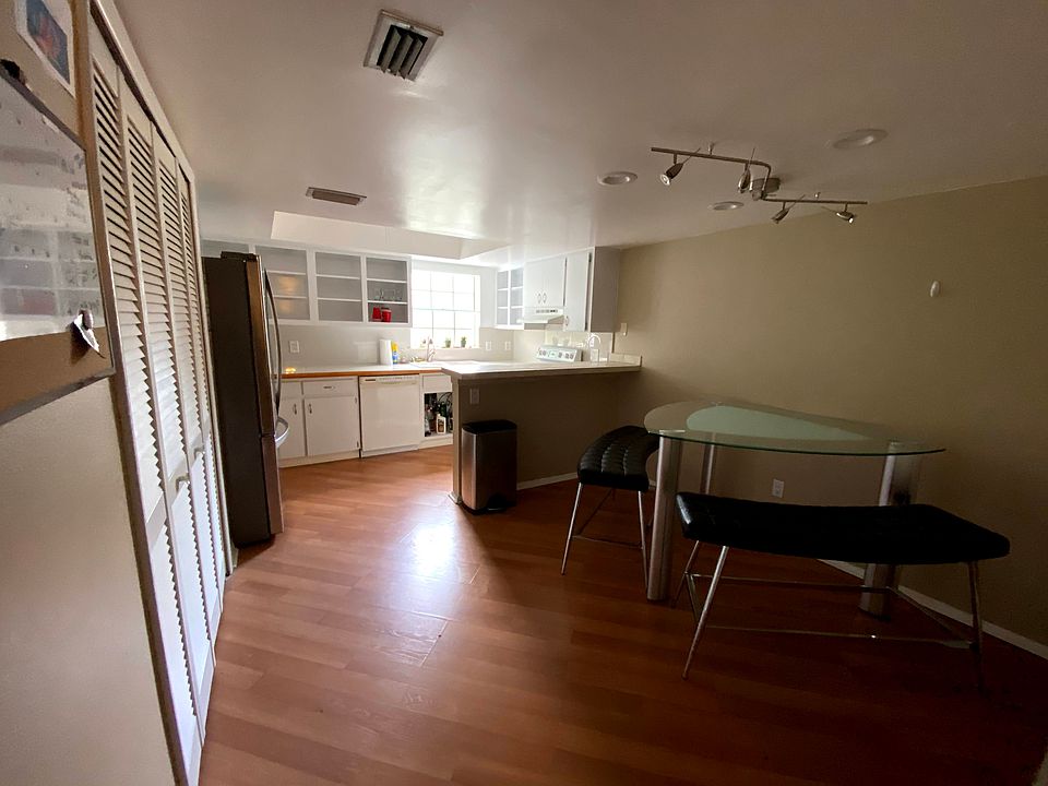 Kitchen with pantry. Overlooks the unit's parking area.