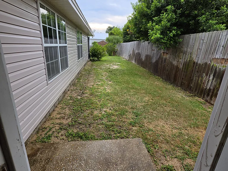 Side yard leading to the back yard