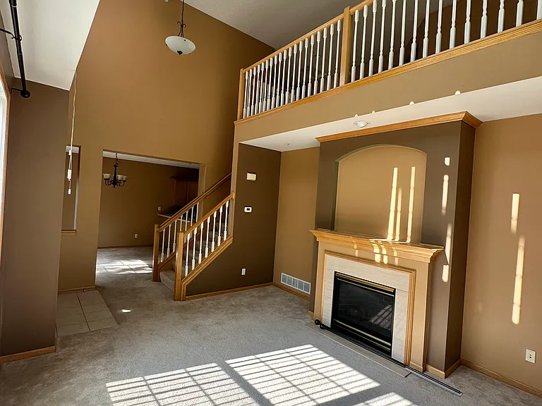 Livingroom with granite gas fireplace.