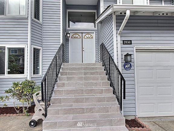 Wide stairwell with double railing. 