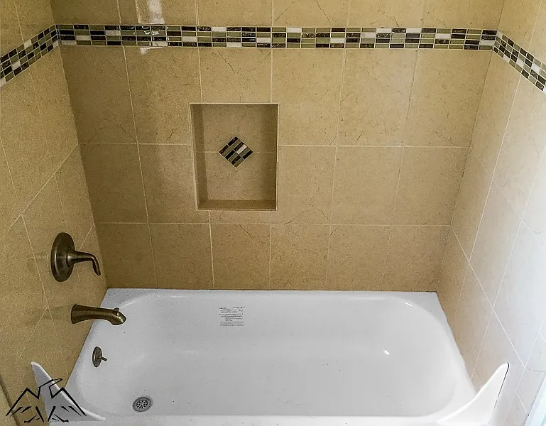 Custom tiled tub enclosured