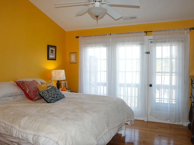 Master bedroom with walk-in closet and jetted tub
