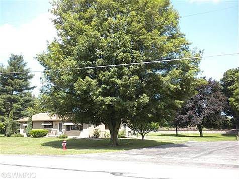 Beautiful, mature shade trees and paved drive.