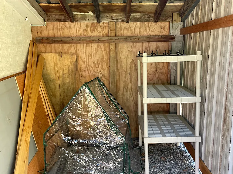 Inside of tarp covered shed area