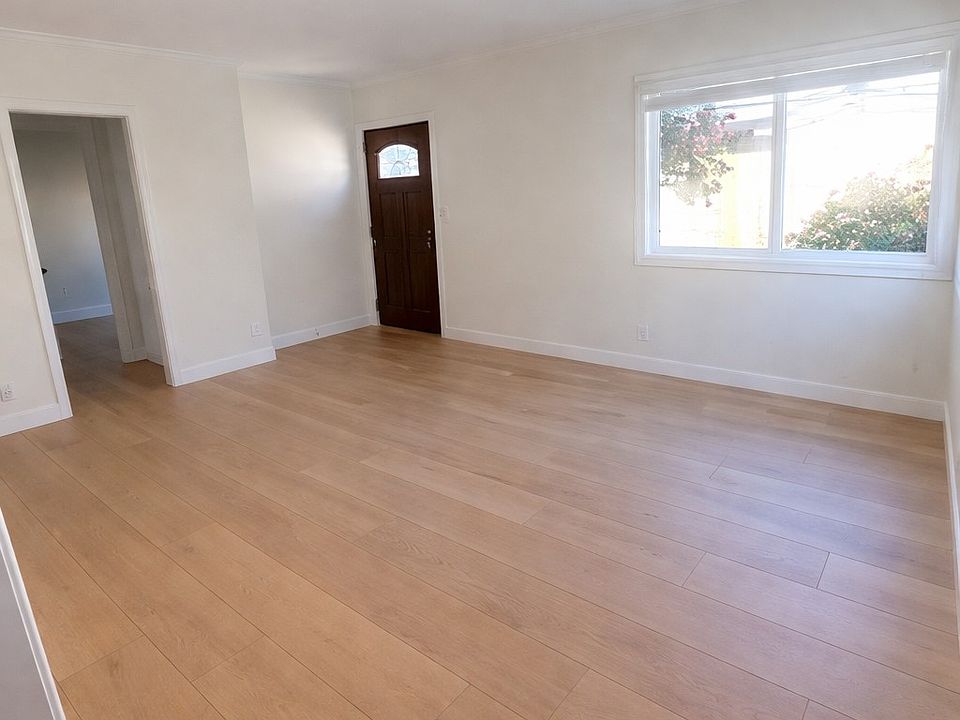 View of living room and main entry as seen from the kitchen
