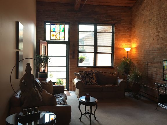 Living room with exposed brick wall